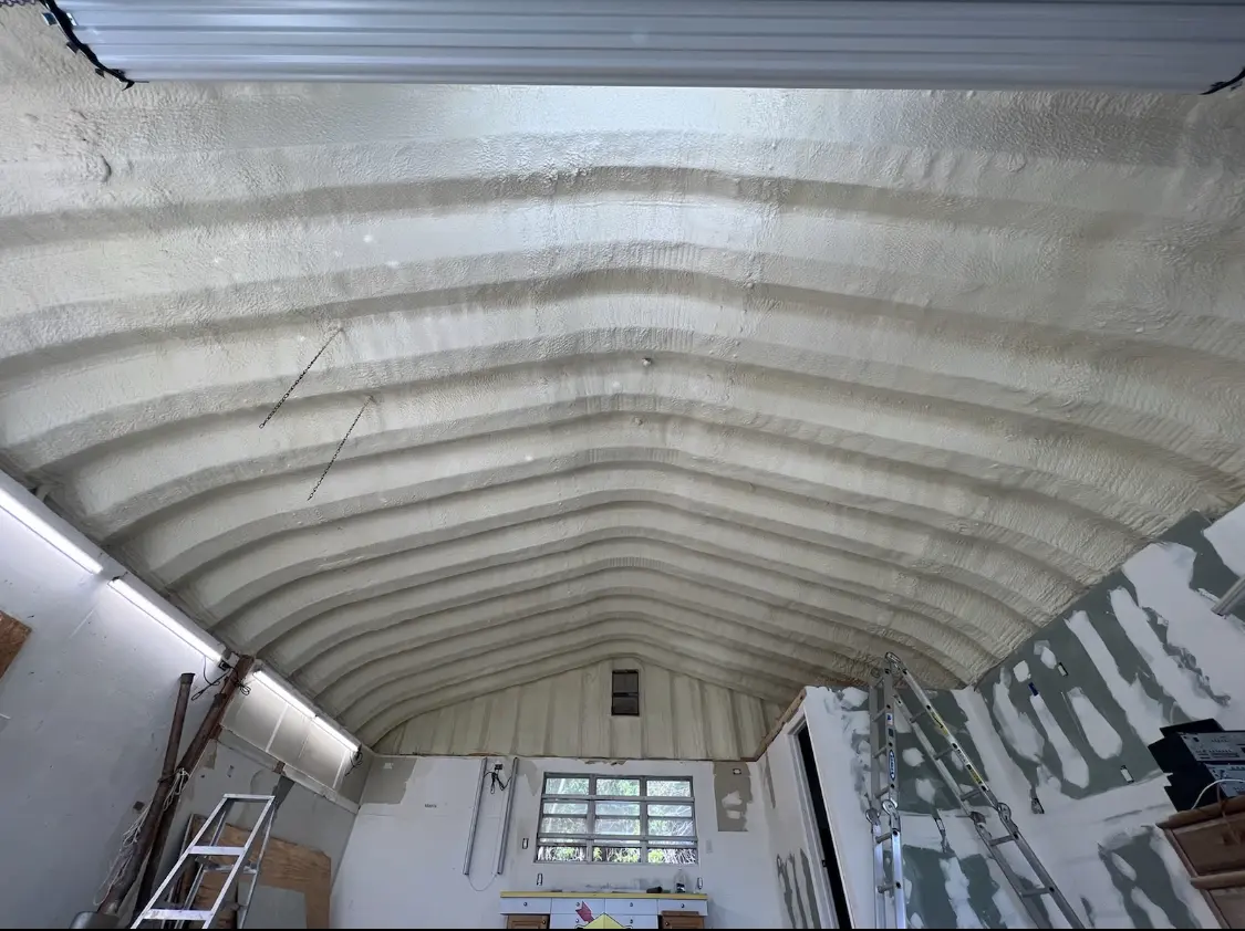 Spray polyurethane foam applied to the underside of a metal roof deck in University